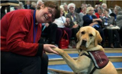 Rev. Mary Whittaker and Scott the dog