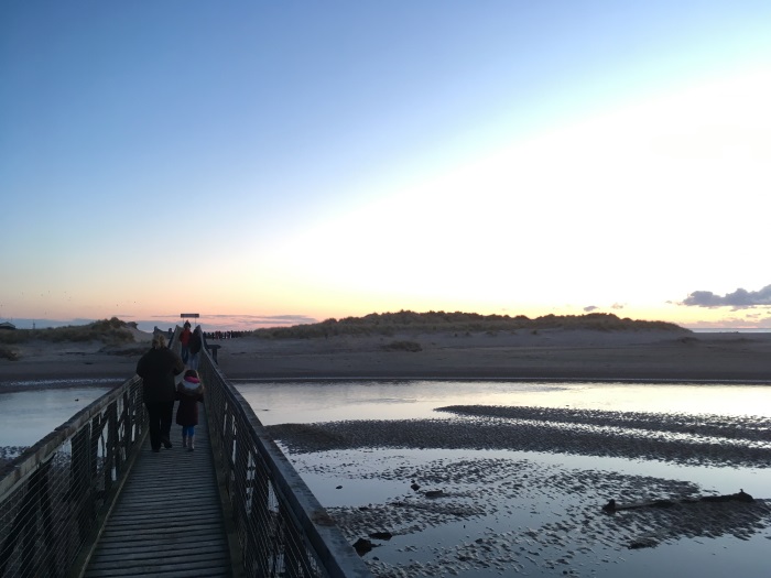 People cross the East Beach Bridge to the Easter Sunday Sunrise Service 2018, Lossiemouth, Moray